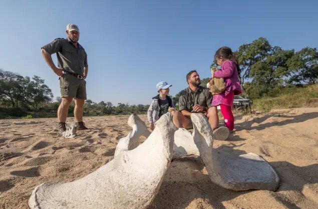 family sitting by a bone